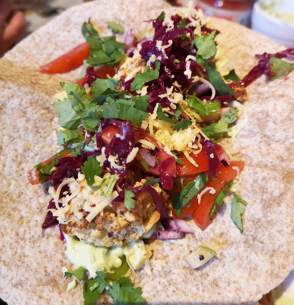 Crispy Cauliflower Tacos with Reclaimed Red Kraut, grated cheese, fresh coriander and tomato salsa