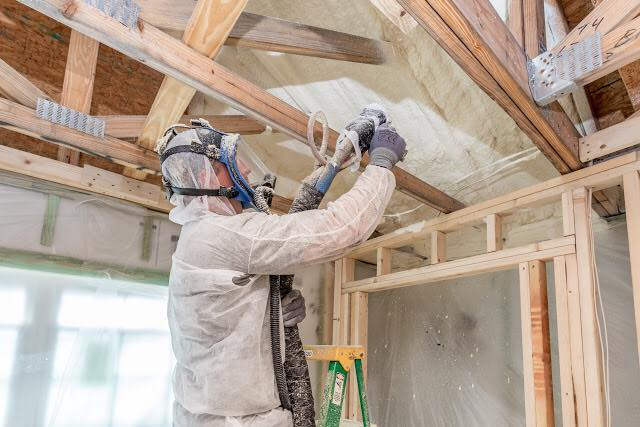 Closed cell spray foam being installed at Stonegate