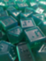 Pile of finished dice in the sunlight