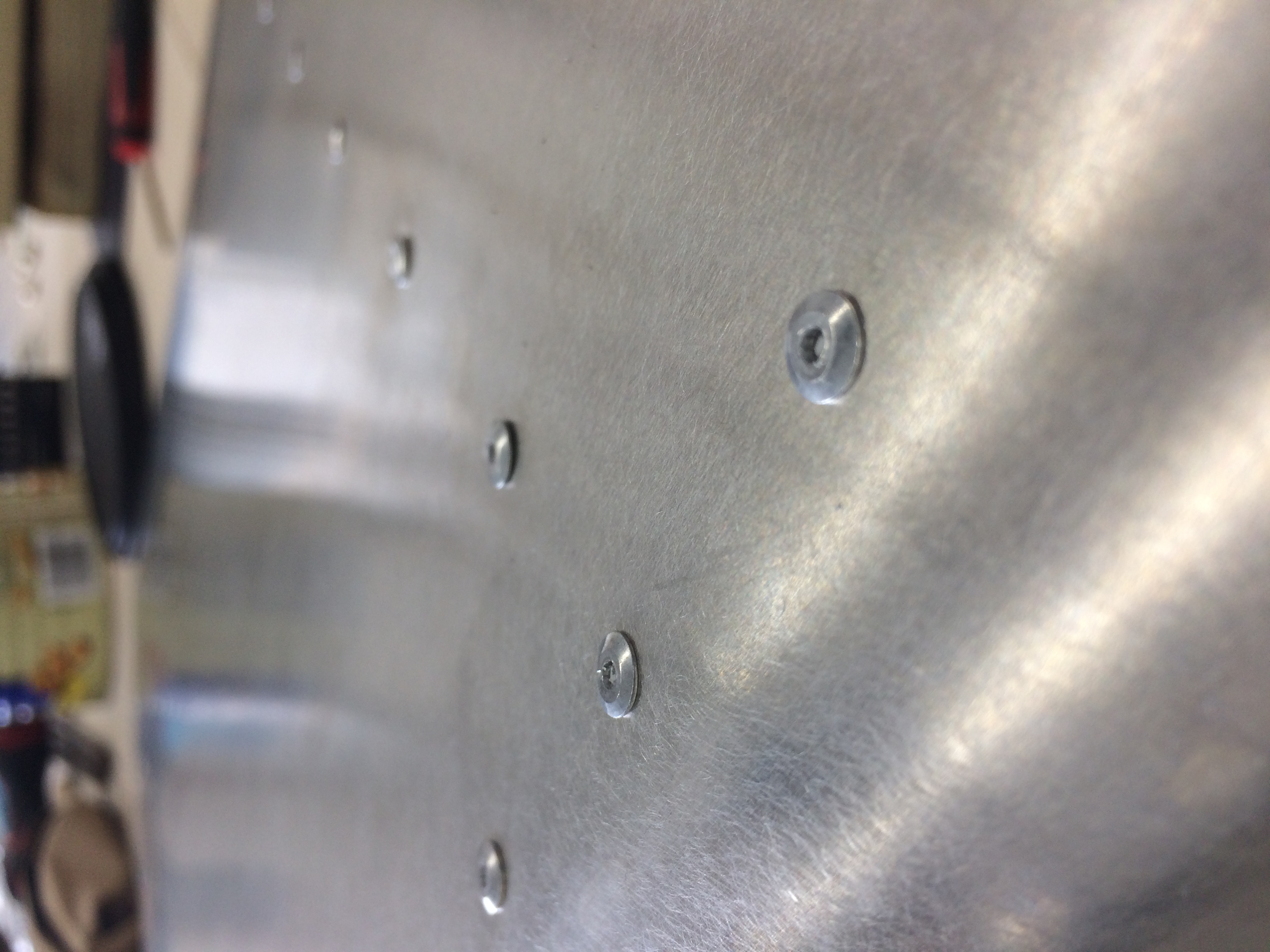 Is this rivet too uneven against the skin? The second one down the rib from the spar. Should I drill out and replace? content media