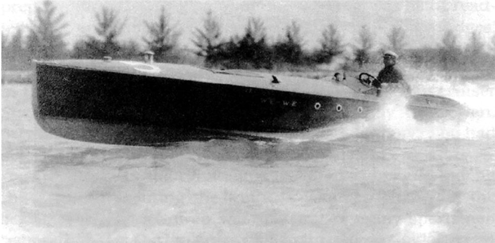Black and white photo of Carl Fisher speeding along Miami's