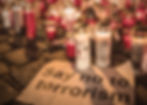 Candles in red an white at the location of the terror attack in Vienna in Austria on 2 November 2020