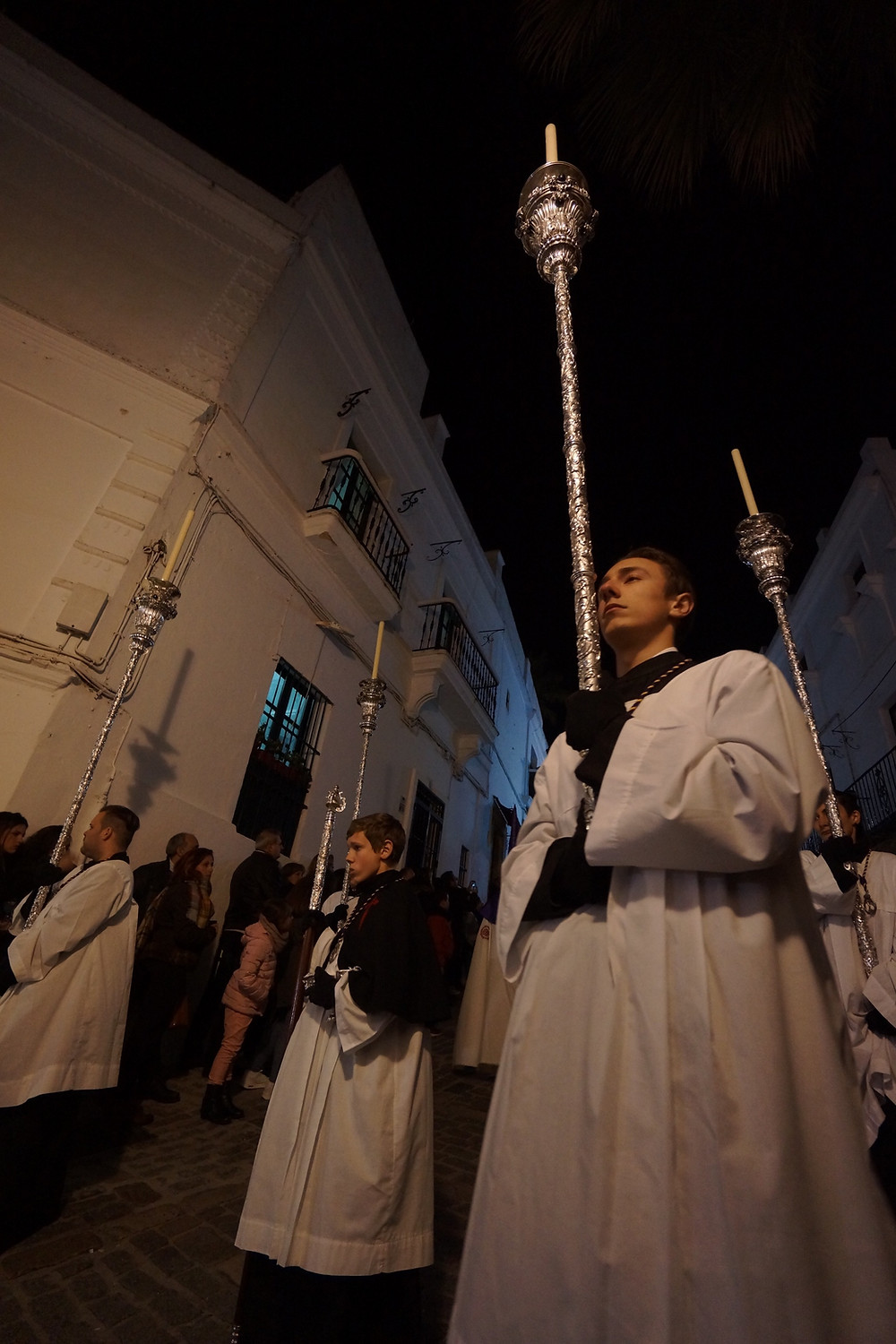One of several Semana Santa processions - participants in white robes