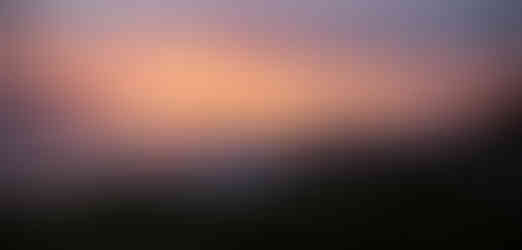 Landscape shot of crashing waves during sunset