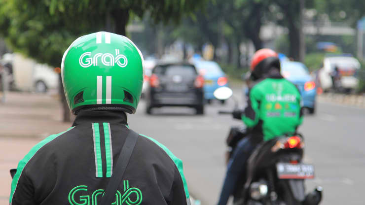 Softbank-backed Grab falls more than 20% in first day of trading following largest-ever SPAC merger content media