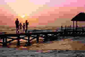 Family walking on jetty