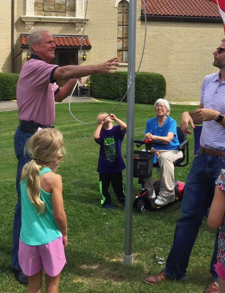 Mary Hardesty on the first day of raising the flag on the German-Paristown Neighborhood Center’s new flagpole, Flag Day 2019.