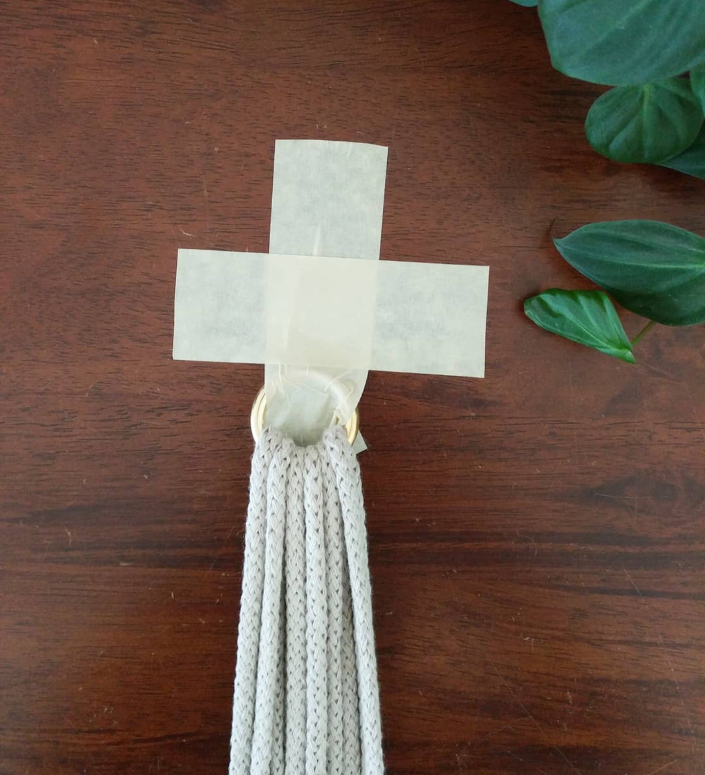 Masking tape method for holding macramé cord