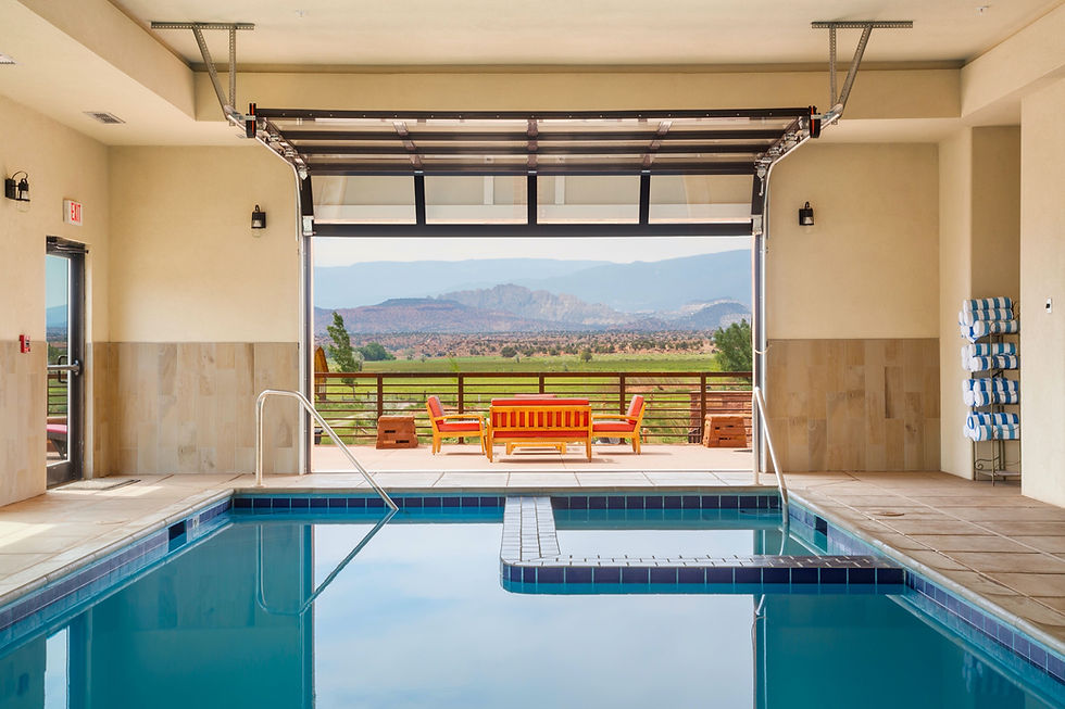 Relax in the hot tub while looking out over green fields and beautiful mountain ranges.