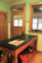 Original double-hung window, transom window, and door to the back sleeping porch (Photo: Jennifer Mach)