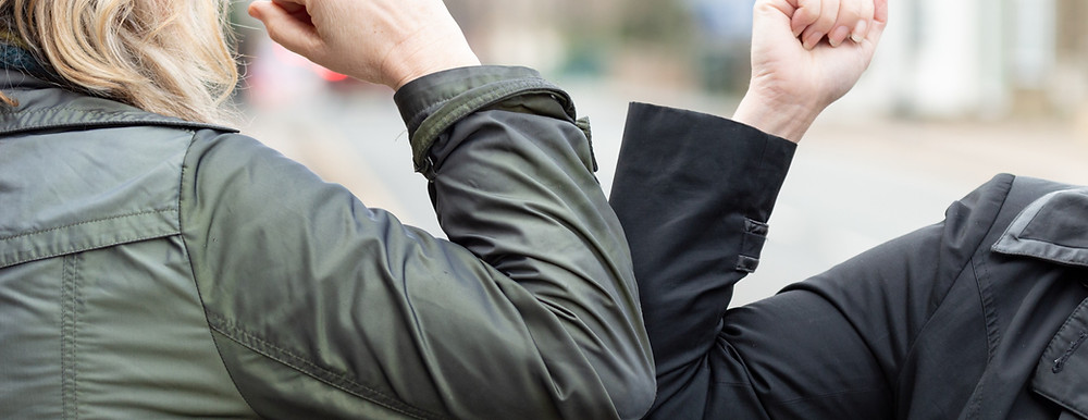 Corona elbow greeting.