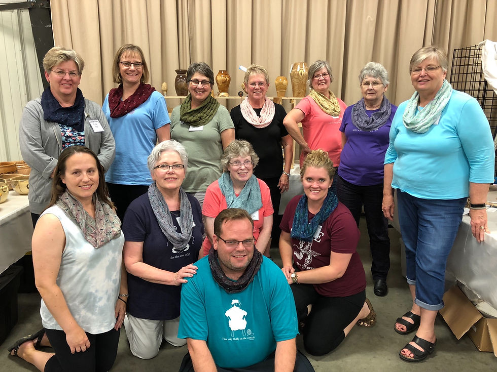 The North Dakota Knitting Group shows off their Soiree Cowls at the Saturday night Fashion Show