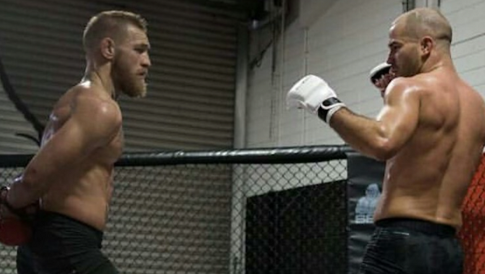 When Conor McGregor and Khabib Nurmagomedov step into the cage together at UFC 229, most fans expect one of two things to happen. The expectation is that McGregor will either knock Nurmagomedov out, our Nurmagomedov will drag McGregor into a grappling hell and possibly stop him on the mat. This feeling, of course, hinges on the perception that Nurmagomedov is not much of a striker, and McGregor is not much of a grappler.  While Conor McGregor’s chief training partner Artem Lobov agrees that Khabib Nurmagomedov doesn’t present much danger in the striking department, he feels its erroneous to assume that McGregor can’t grapple with the lightweight champion.    “When you say it like that, it’s as if Conor doesn’t have wrestling and grappling, and Khabib doesn’t have any striking,” Artem Lobov told The Mac Life this week (transcript via Bloody Elbow). “It is true that Khabib doesn’t really have any striking, but it’s certainly not true that Conor’s grappling or wrestling is not on that level.  “He can easily out-grapple Khabib, and in the wrestling as well. Of course this is Khabib’s game, so we’re not stupid. We’re not gonna fall into his hands right away, but make no mistake about it, we’re gonna be ready everywhere.”  Artem Lobov also offered a specific prediction for this Khabib Nurmagomedov vs. Conor McGregor fight. He expects his friend and training partner to win in the first round.  “I see Conor stopping him in round one,” Artem Lobov stated confidently. “I just don’t see Khabib being able to do anything.”  “Look at some of his other fights [Khabib has] been in. The [Al] Iaquinta fight, when he was connecting, Khabib did not like it at all. He was going back, leaning back, turning away, closing his eyes.”  “The same against Michael Johnson. When Michael Johnson connected, Khabib couldn’t take him down anymore. The only reason they ended up on the floor was because Michael Johnson decided to wrap up the guillotine and bring him down himself — which was the biggest mistake of his life. I’m sure he still regrets that. Either than that, he had stuffed Khabib’s takedowns already.”  “So I see all that, I see Conor in training. I see his timing, I know his wrestling, how good his grappling as well. I just don’t see it any other way. First round stoppage for Conor McGregor.”  What do you think of Artem Lobov’s assessment of UFC 229’s Khabib Nurmagomedov vs. Conor McGregor main event?