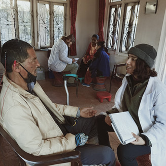 Nepalese man works with female practitioner