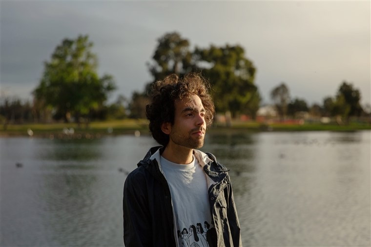 Benjamin Cruz in front of lake.