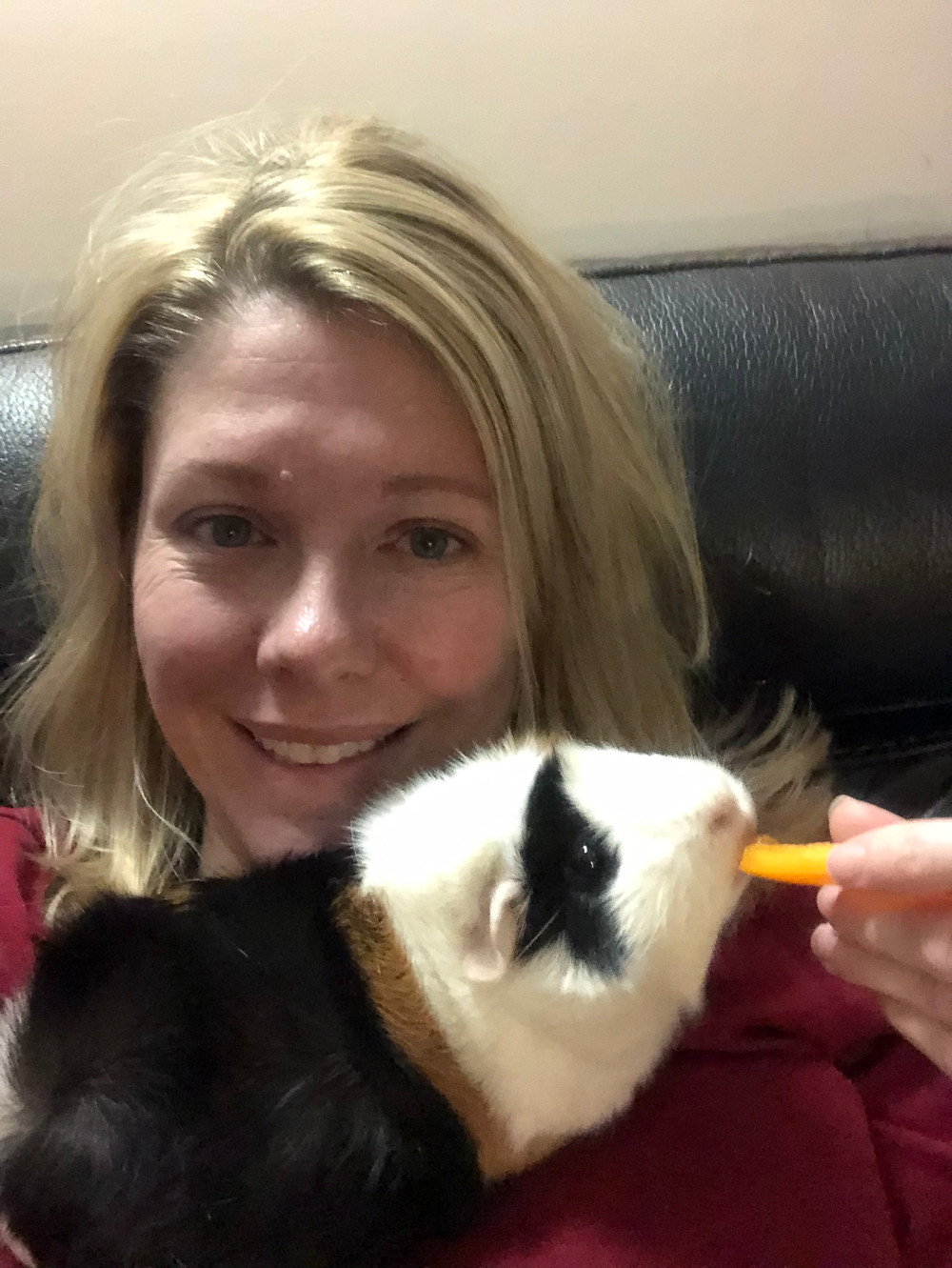 Cheryl feeding Maizey a piece of bell pepper