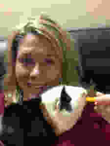 Cheryl feeding Maizey a piece of bell pepper