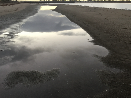 Cloudy Reflections on the Beach