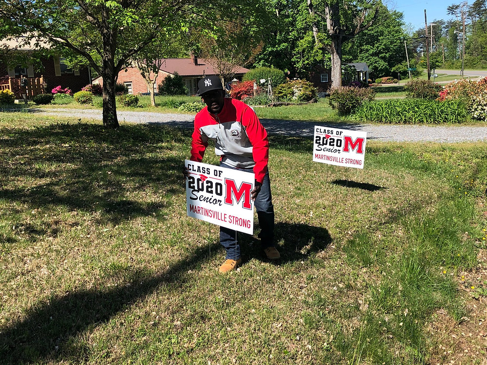 Martinsville High School delivers yard signs to its graduating seniors