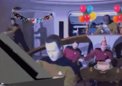 A gif of the bridge crew of the Enterprise from Next Gen having a birthday party!