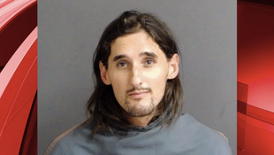 Man in custody, charged after nearly 10-hour long standoff