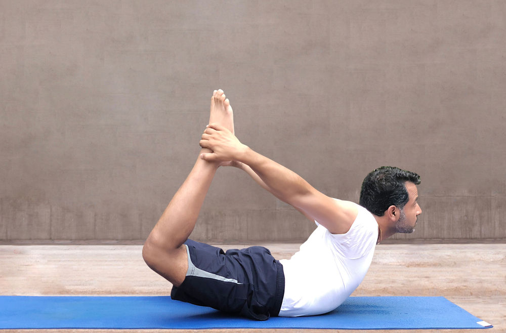Dhanurasana (Bow Pose Yoga) Benefits & Contraindications