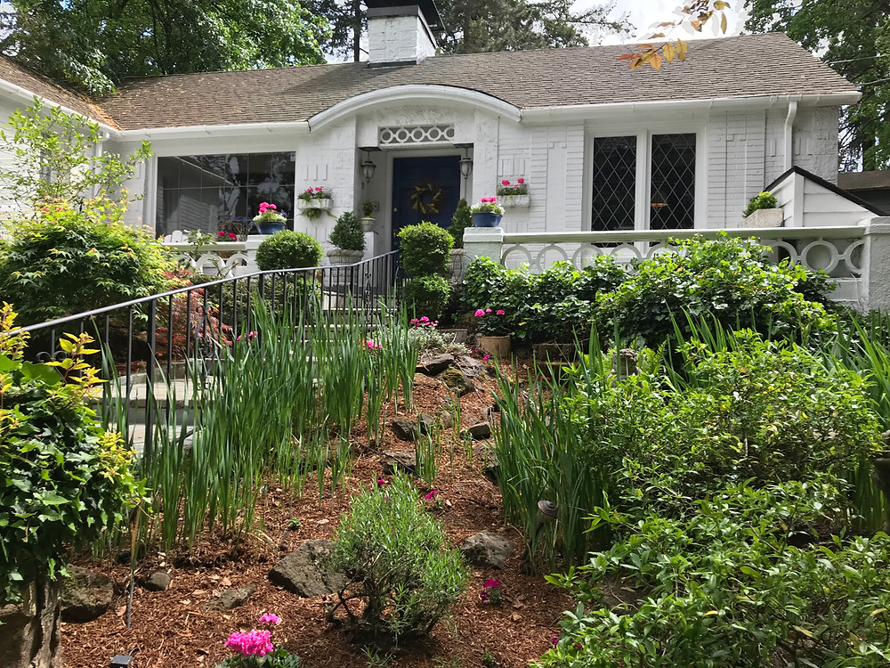 Lake Oswego home, Lake Oswego Cottage, White House, front yard garden, no grass yard, leaded glass, balustrades, cinder block circles, Pacific Northwest house, Oregon house