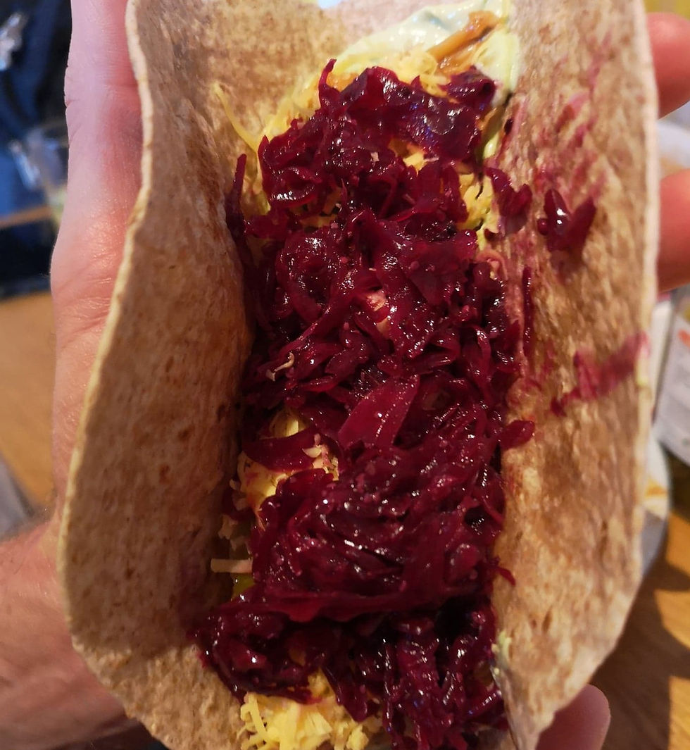 Tortilla filled with reclaimed red kraut and grated cheese