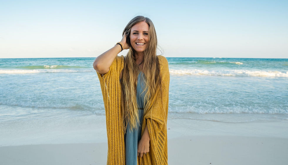 Rachel Brathen standing on a beach for a photoshoot