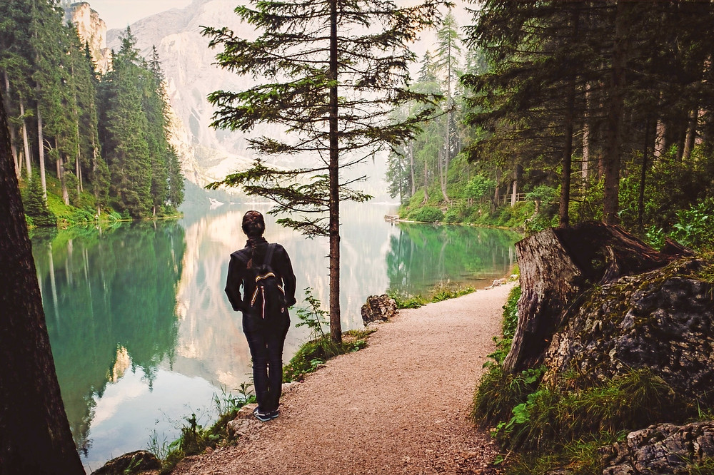 person reflecting on a walking path