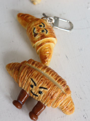 a polymer clay croissant with a naughty face: made at a polymer clay workshop in toronto