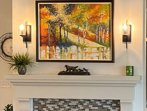 Maximalist vs minimalist decor example featuring autumn reflecting on water oil painting used as a calming focal point in home styling.