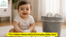 "Baby beside a bin filled with used disposable nappies, highlighting diaper waste"