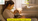 "Breastfeeding mother and baby sharing a calm moment near a crib"