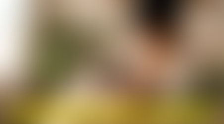 "Mother gently supporting her baby during feeding time"