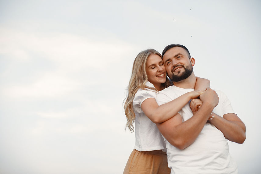 cute-couple-in-a-field-lady-in-a-white-blouse-guy-in-a-white-shirt.jpg