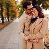 fashionable-man-woman-embarrassing-while-dating-autumn-park-wearing-stylish-beige-coats-ro