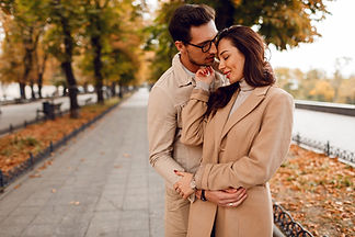 fashionable-man-woman-embarrassing-while-dating-autumn-park-wearing-stylish-beige-coats-ro