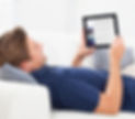 man-using-digital-tablet-with-blank-screen-sofa (1) 1.jpg