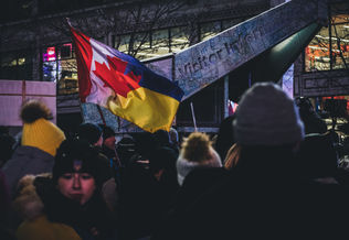 Canada flag integrated with Ukrainian flag at a protest in Toronto, Canada.