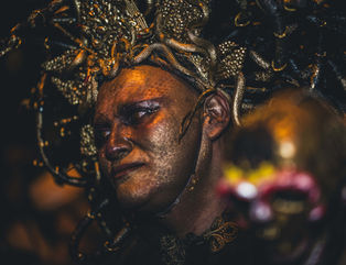 Person dressed as Medusa and painted in gold for Halloween in Toronto, Canada.