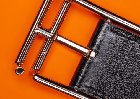 Hermès belt in an in-home Toronto studio with soft studio lighting highlighting shape and details.
