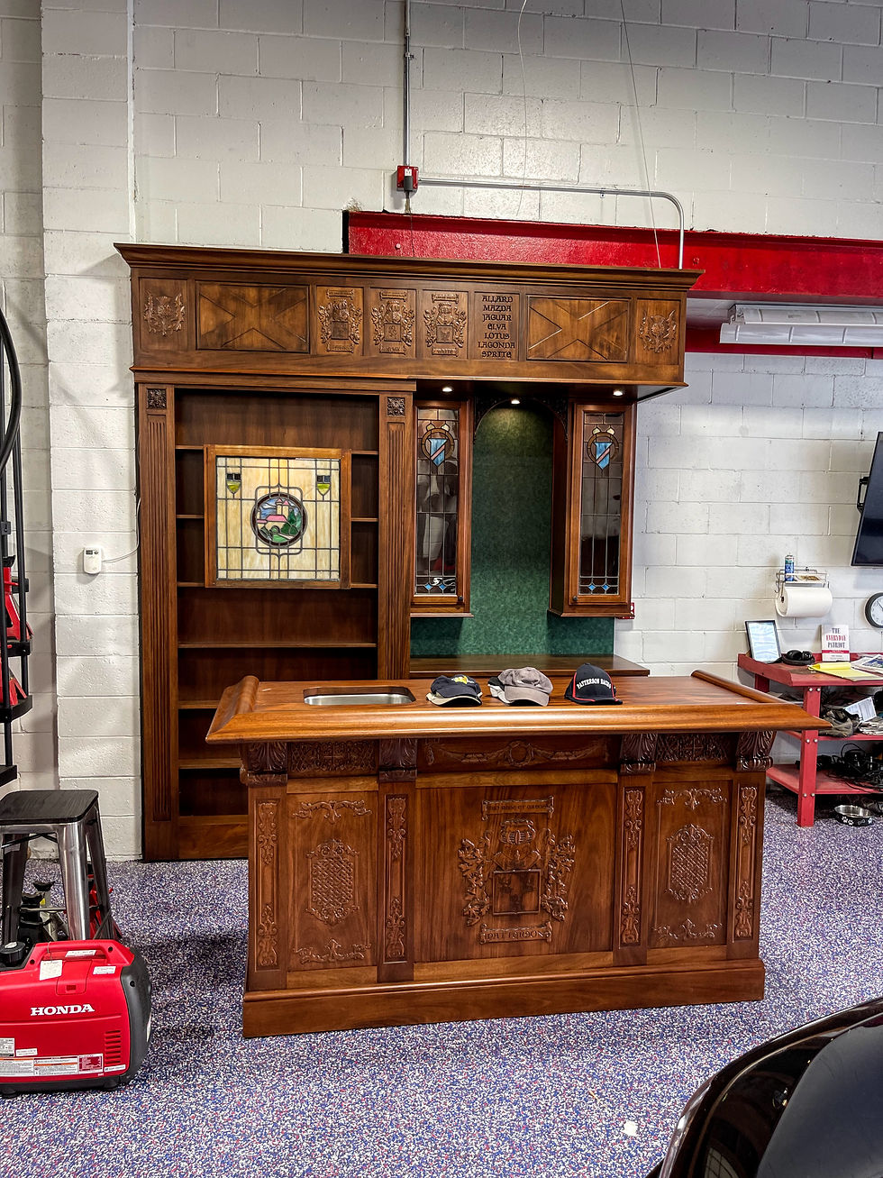 Mahogany bar with custom carved panels, stained-glass, and bar sink in Pittsburgh Pa