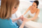 Labouring parent in a tub in hospital
