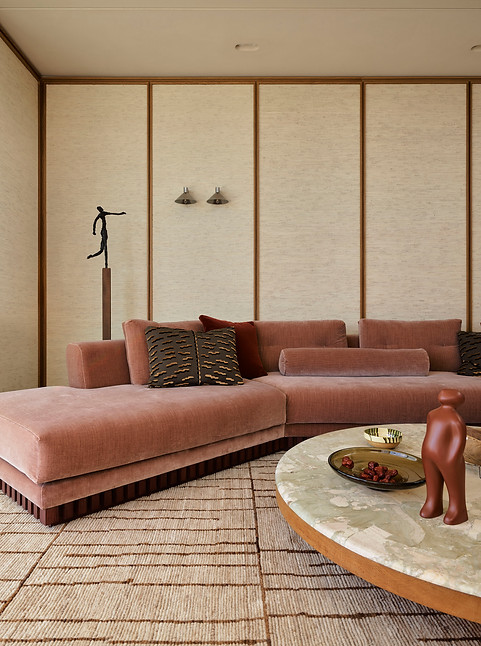 confortable lounge with rattan wallpaper panels behind sydney interior design the carlisle tamarama