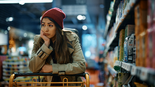 Depressed girl at grocery store