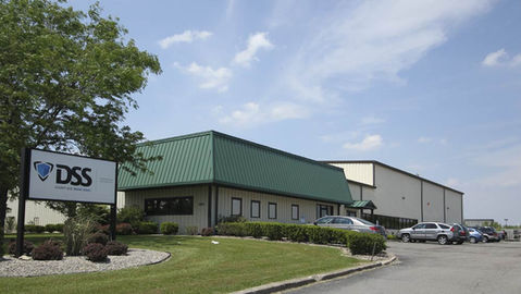 Tan Industrial and Manufacturing Building with green roof