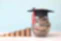 graduation-hat-coins-money-glass-bottle-