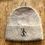 Thumbnail: Mocha Angora toque with V I P vertically next to stickman with cane, black logo