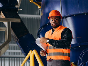 african-american-worker-standing-uniform-wearing-safety-hat-factory.jpg